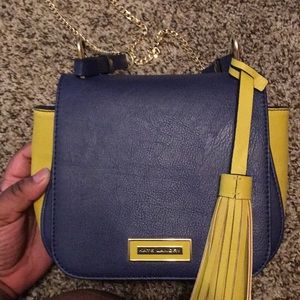 I am selling a Kate Landry shoulder purse.